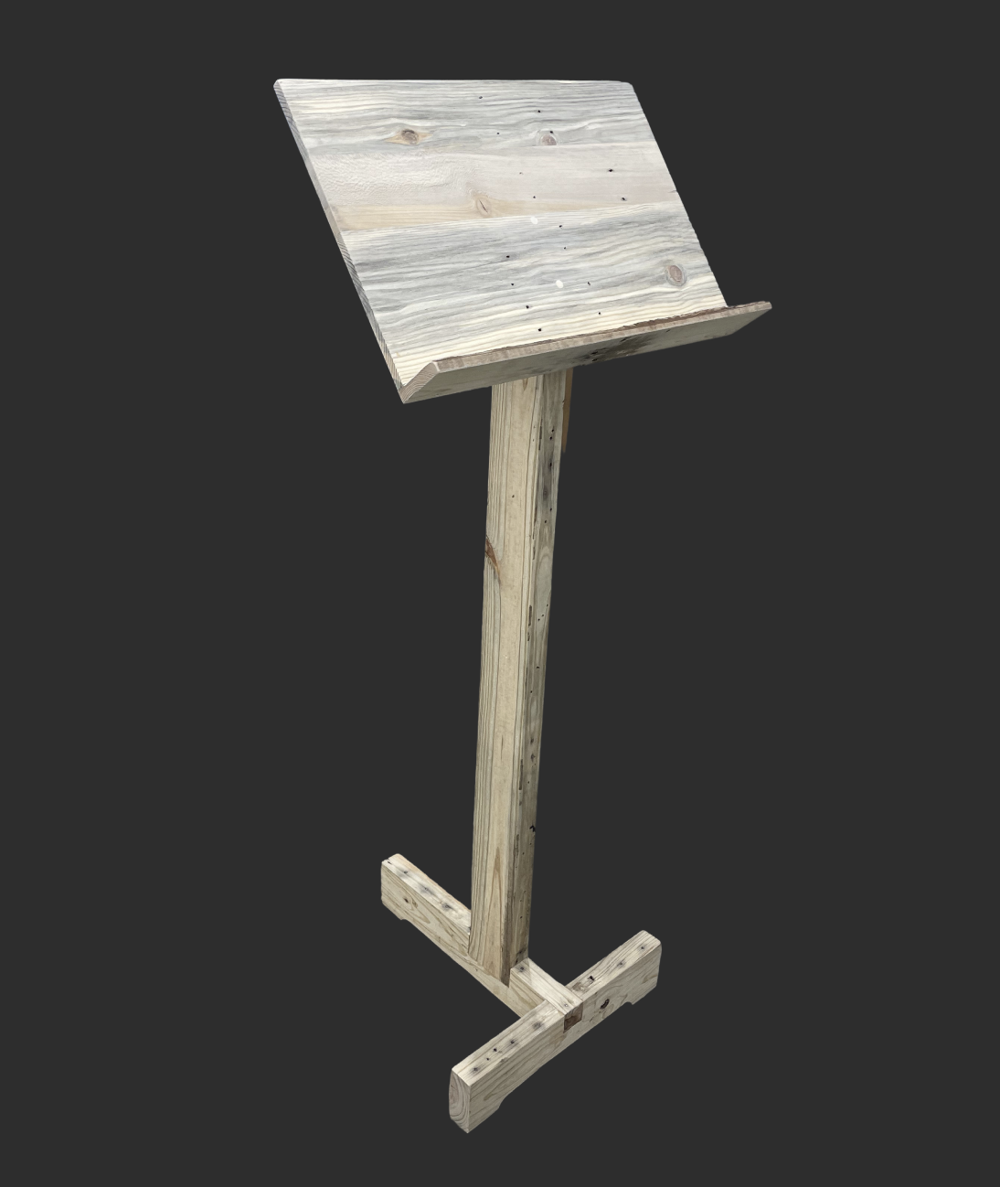 Music stand made from pallet wood: a slanted reading desk with a ledge, on a single upright post with a T-shaped foot.